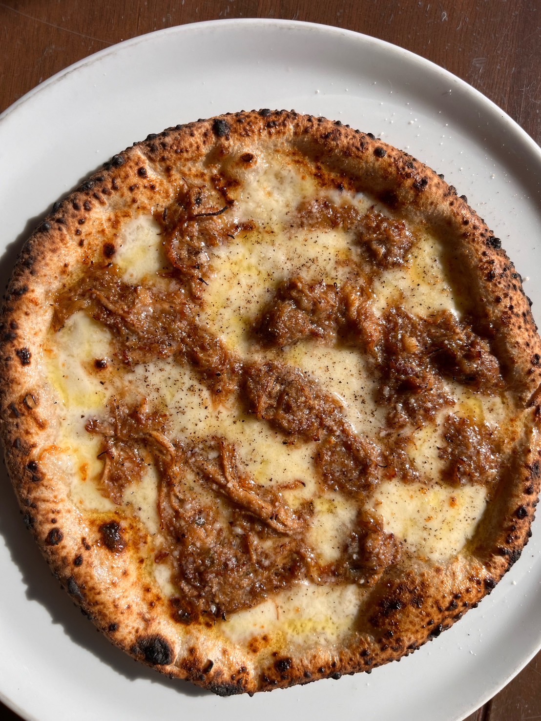 当店オリジナル豚肉と玉葱の煮込みのせピザ